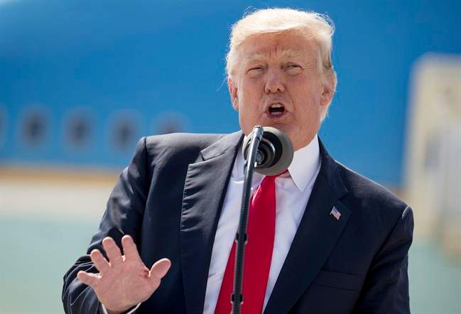  In this June 13, 2017, photo, President Donald Trump speaks in front of Air Force One in Milwaukee, Wis. 