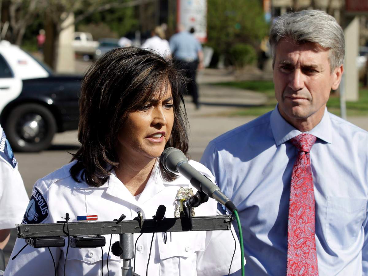 Minneapolis Police Chief Janee Harteau, left, and Mayor R.T. Rybak address the media Friday, May 10, 2013 in Minneapolis.