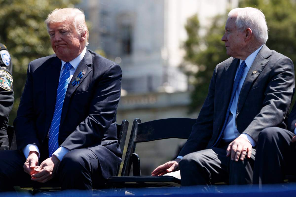 Attorney General Jeff Sessions talks to President Donald Trump during the 36th annual National Peace Officers Memorial Service, Monday, May 15, 2017, on Capitol Hill in Washington.