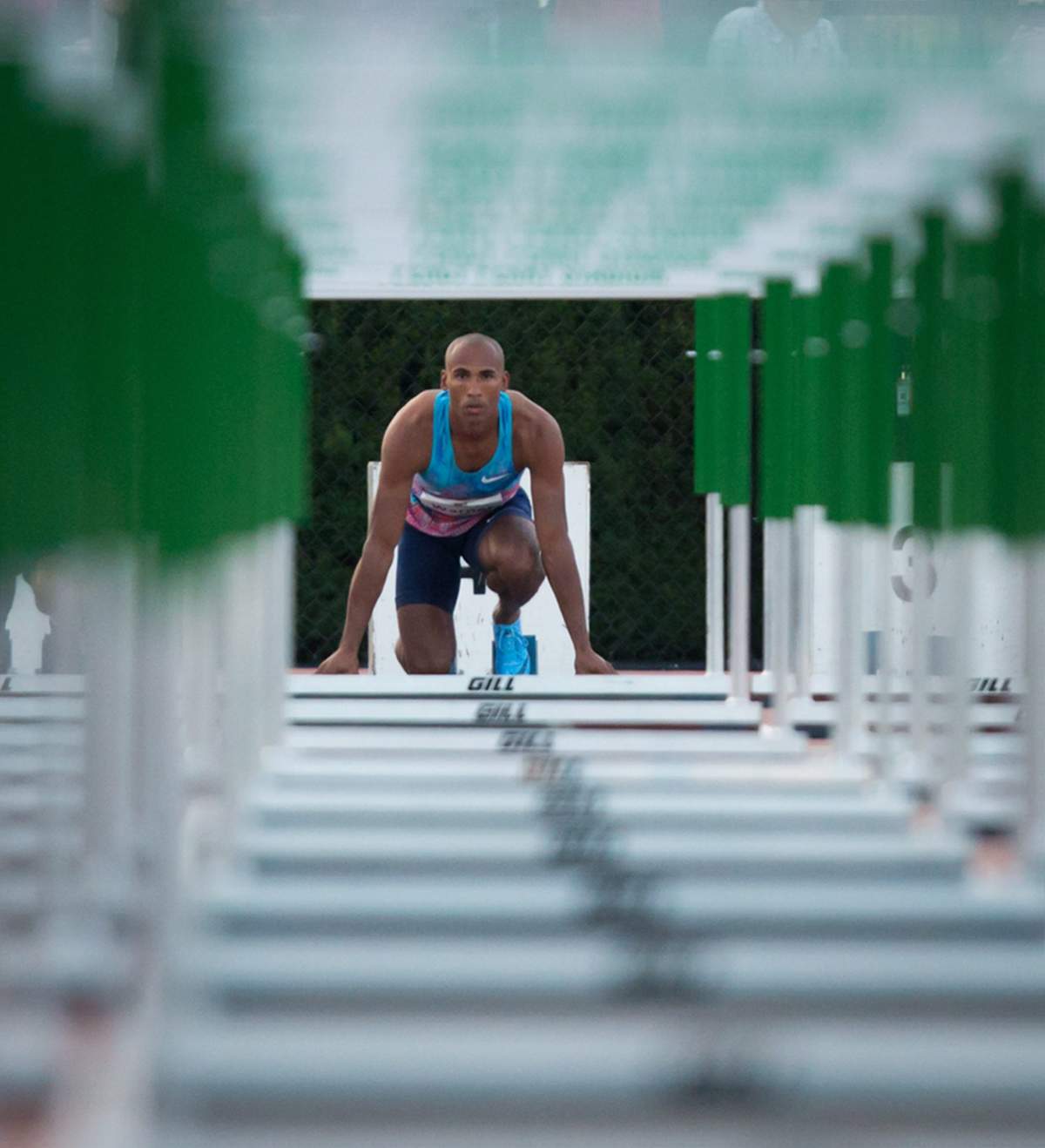 Canada's Damian Warner, of London, Ont., is framed by hurdles as he waits in the starting blocks before racing to a first place finish in the men's 110 metre hurdles at the Harry Jerome International Track Classic in Coquitlam, B.C., on Wednesday June 28, 2017.