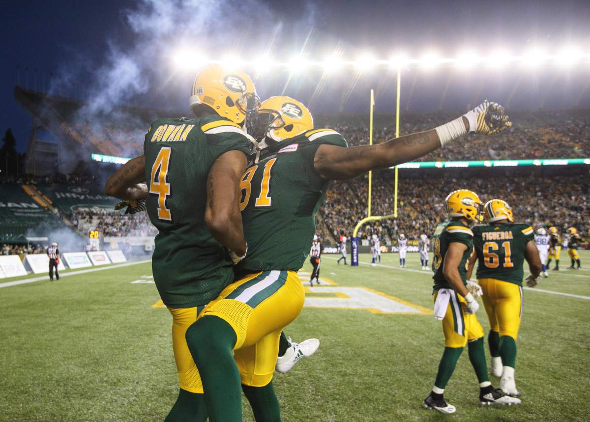 Edmonton Eskimos’ Adarius Bowman (4) and D’haquille Williams (81) celebrate a touch down during second half CFL action against the Montreal Alouettes, in Edmonton on Friday, June 30, 2017.