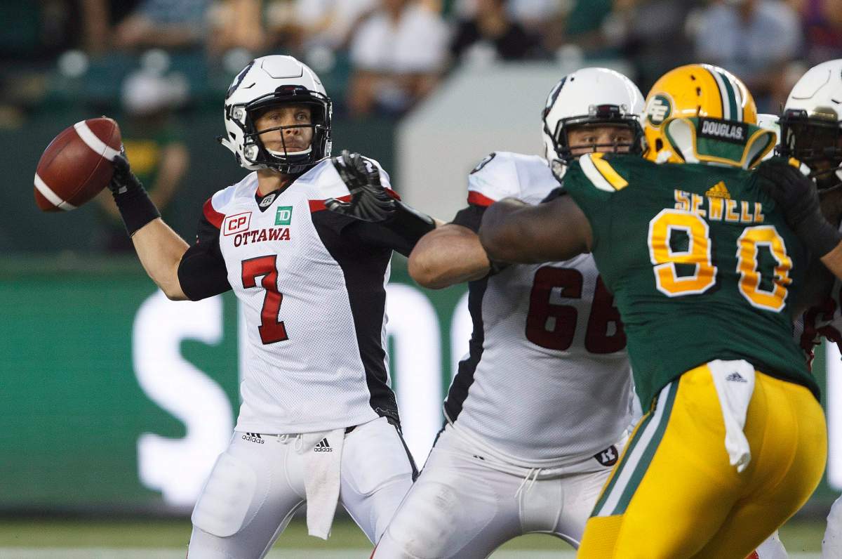 Ottawa Redblacks’ Trevor Harris (7) makes the throw against the Edmonton Eskimos during second half CFL action in Edmonton, Alta., on Friday July 14, 2017. THE CANADIAN PRESS/Jason Franson.
