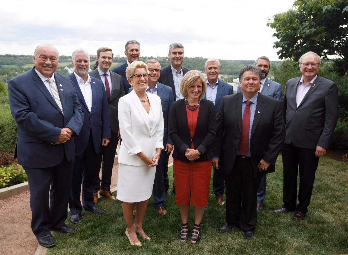 Canadian Premiers from back left, Bob McLeod, Northwest Territories, Philippe Couillard, Quebec, Brian Gallant, New Brunswick, Brian Pallister, Manitoba, Stephen McNeil, Nova Scotia, Dwight Ball, Newfoundland and Labrador, Sandy Silver, Yukon, Wade MacLauchlan, Prince Edward Island, Kathleen Wynne, Ontario, Brad Wall, Saskatchewan, Rachel Notley, Alberta and Peter Taptuna, Nunavut, pose for a group photo during the Council of Federation meetings in Edmonton Alta, on Tuesday July 18, 2017.