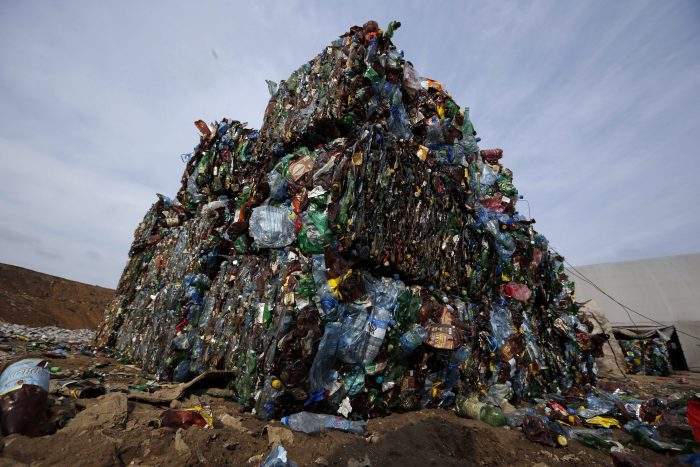 FILE - In this March 12, 2015 file photo, plastic trash is compacted into bales ready for further processing at the waste processing dump on the outskirts of Minsk, Belarus. 