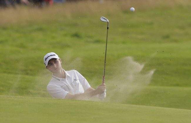 Canada's Austin Connelly plays out of a bunker on the 17th hole during the third round of the British Open Golf Championship, at Royal Birkdale, Southport, England, July 22, 2017.