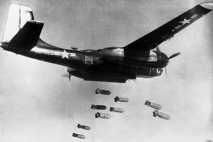 In this March 18, 1953, file photo, bombs drop from a U.S. Air Force 3rd bomber wing B26 light bomber somewhere in North Korea. 