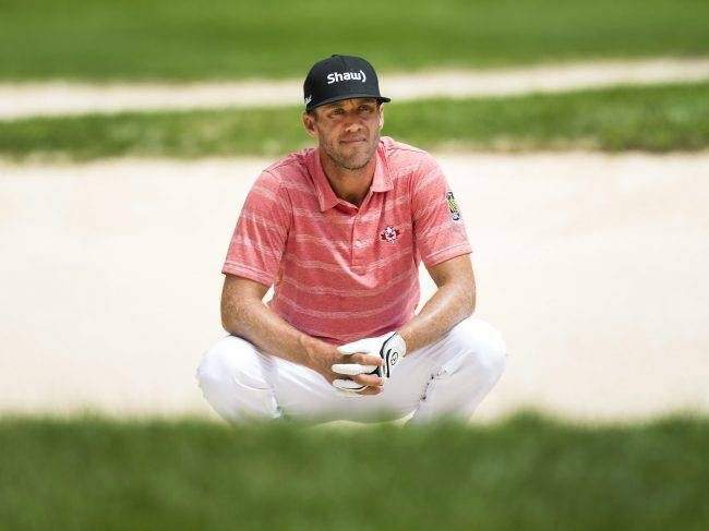 Graham DeLaet looks out from the bunker on the 13th hole during the Canadian Open golf tournament at Glen Abbey golf club, in Oakville, Ont., on Saturday, July 29, 2017.