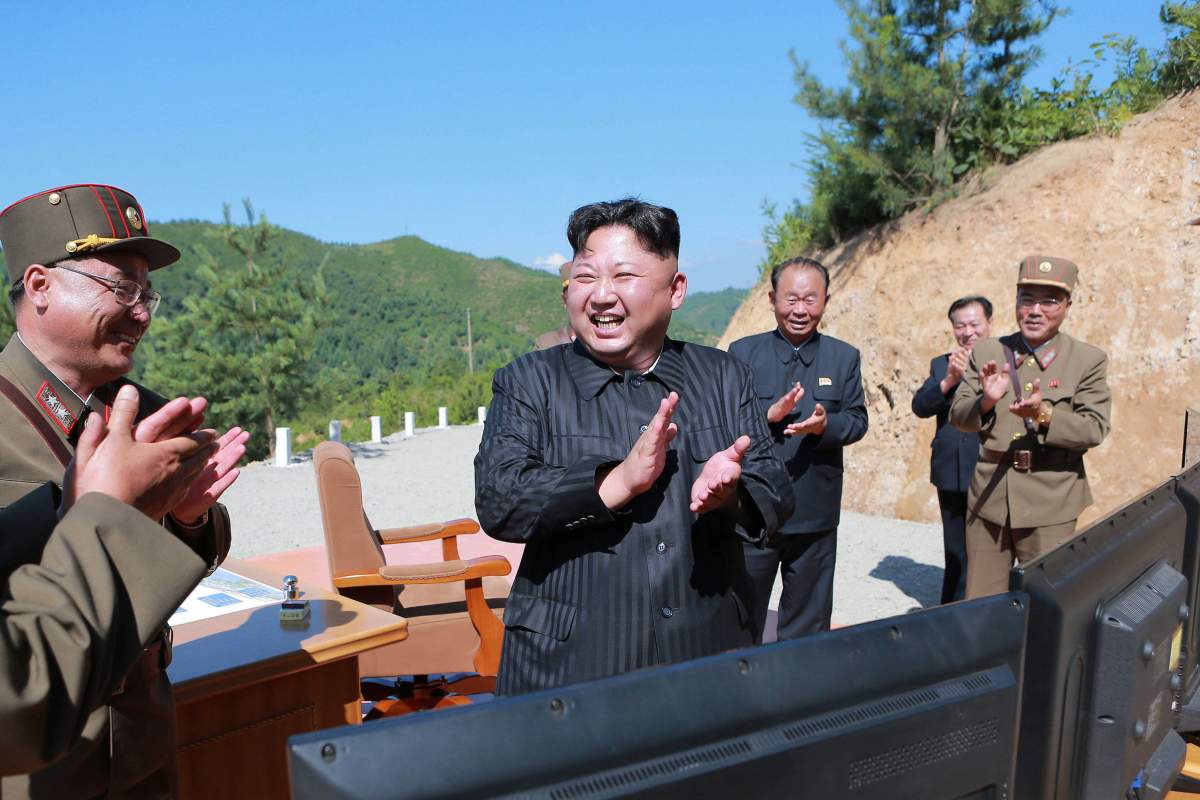 North Korean leader Kim Jong Un reacts with scientists and technicians of the DPRK Academy of Defence Science after the test-launch of the intercontinental ballistic missile Hwasong-14 in this undated photo released by North Korea’s Korean Central News Agency (KCNA) in Pyongyang July, 5, 2017.