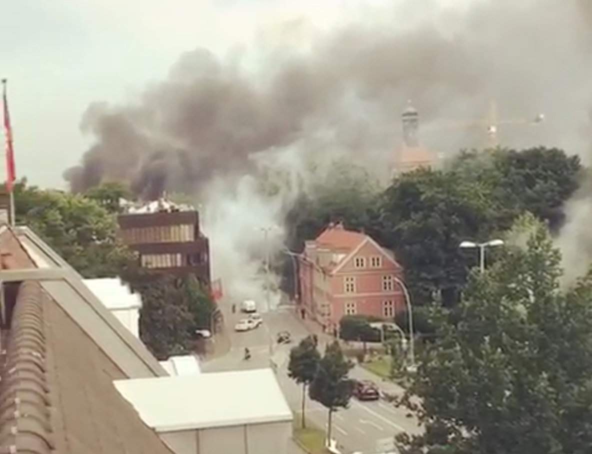 Smoke is seen from an apartment during anti-G20 protests in Hamburg Friday.