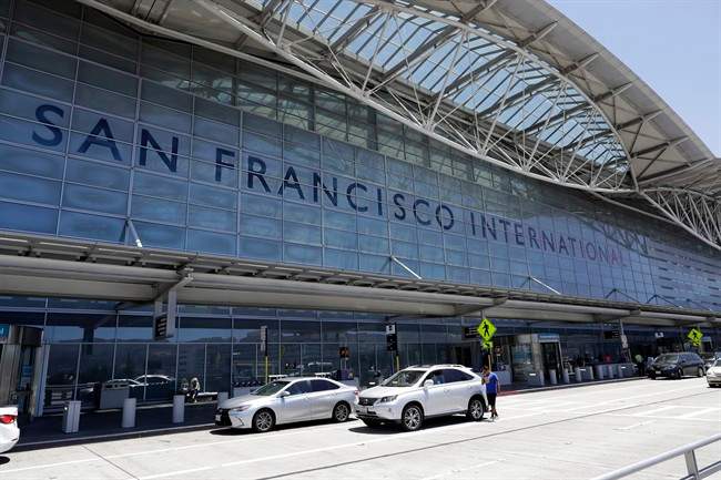 Vehicles wait outside the international terminal at San Francisco International Airport Tuesday, July 11, 2017, in San Francisco.