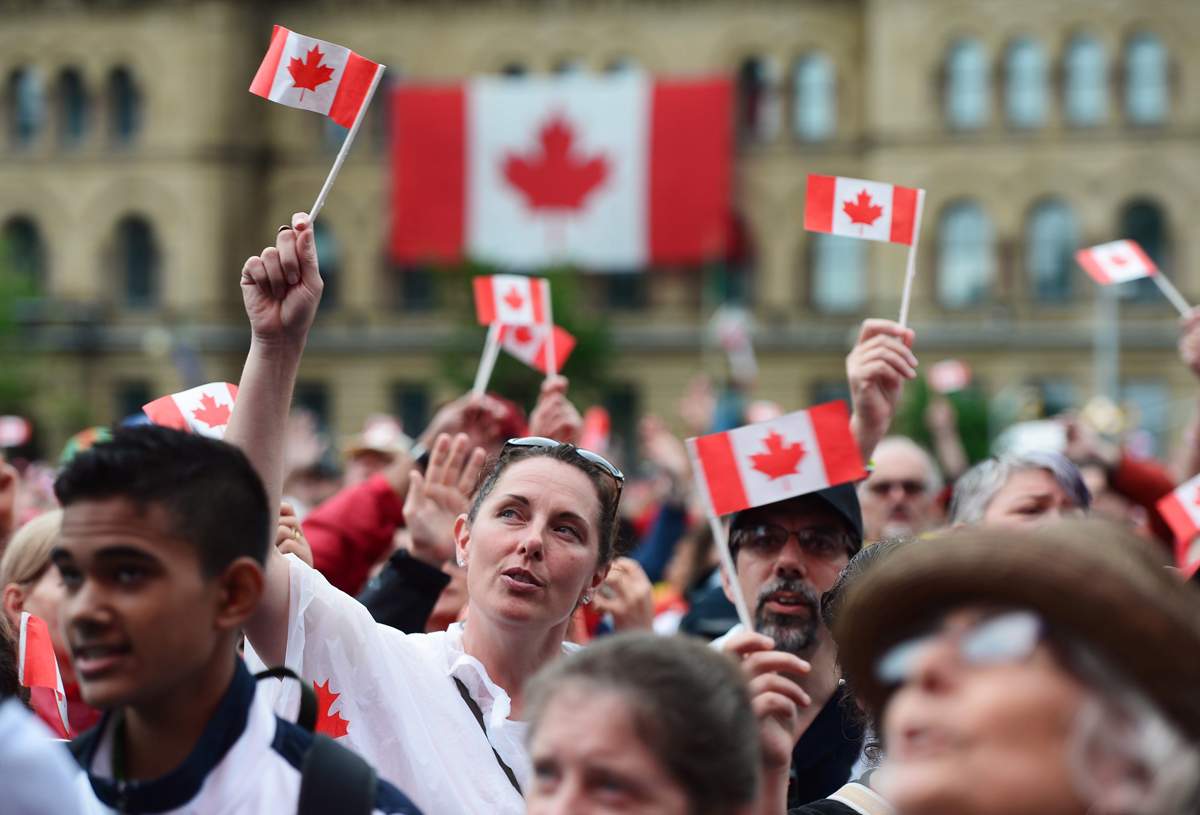 People take in the Canada 150 celebrations on Parliament Hill in Ottawa on Saturday, July 1, 2017. 