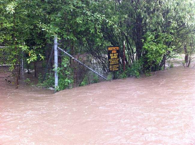 Floodwaters from a nearby creek running into Alberta's Lesser Slave Lake inundate a contaminated site near Faust, Alta. in this undated handout photo. The Alberta government is considering cleaning up a former wood-preserving site along one of the province's biggest lakes and turning the adjacent land into a day-use area. 