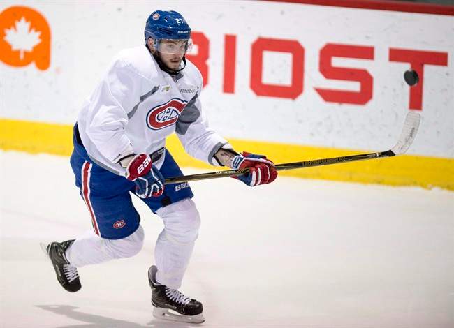 Montreal Canadiens' Alex Galchenyuk goes after a flying puck during a practice on April 10, 2017 in Brossard, Que. Alex Galchenyuk agreed to a three-year contract with the Montreal Canadiens on Wednesday and now the question is where he will play next season. Thursday, July 6, 2017.