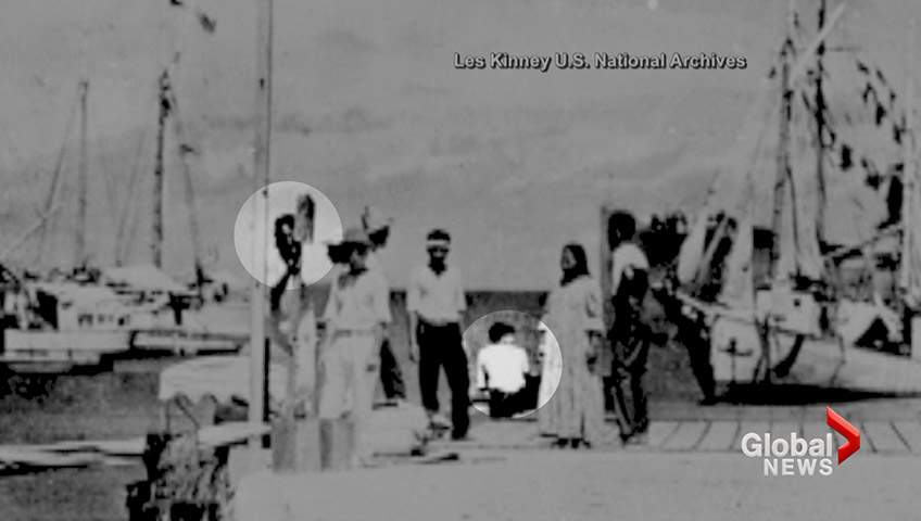 People who look similar to Amelia Earhart and her navigator are shown in this photo from the U.S. National Archives.