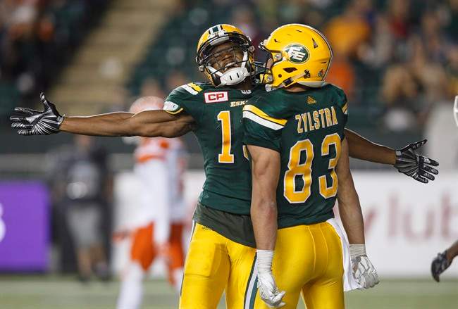 Edmonton Eskimos wide receiver Vidal Hazelton (15) and wide receiver Brandon Zylstra (83) celebrate the two point conversion against the B.C. Lions during second half CFL action in Edmonton, Alta., on Friday July 28, 2017. 