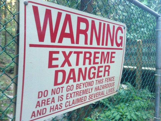 A sign warning of extreme danger at Twin Falls in North Vancouver’s Lynn Canyon.
