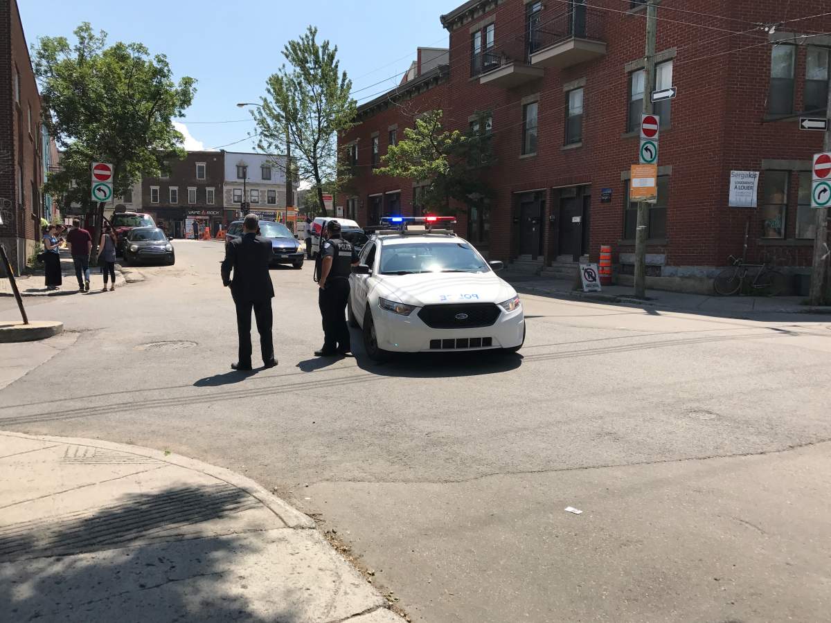 A police officer monitoring Workman and Rose-de-Lima streets on Tuesday, July 18, 2017.