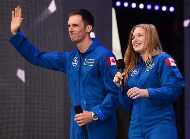Canada’s newest astronauts Joshua Kutryk and Jennifer Sidey acknowledge the crowd during Canada 150 celebrations on Parliament Hill in Ottawa on Saturday, July 1, 2017.