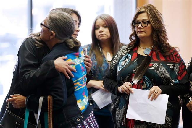 Family members of the Missing and Murdered Indigenous Women and Girls (MMIWG) and Coalition co-chairs greet each other prior to a press conference calling for a re-organization of the National Inquiry into MMIWG in Winnipeg, Wednesday, July 12, 2017.