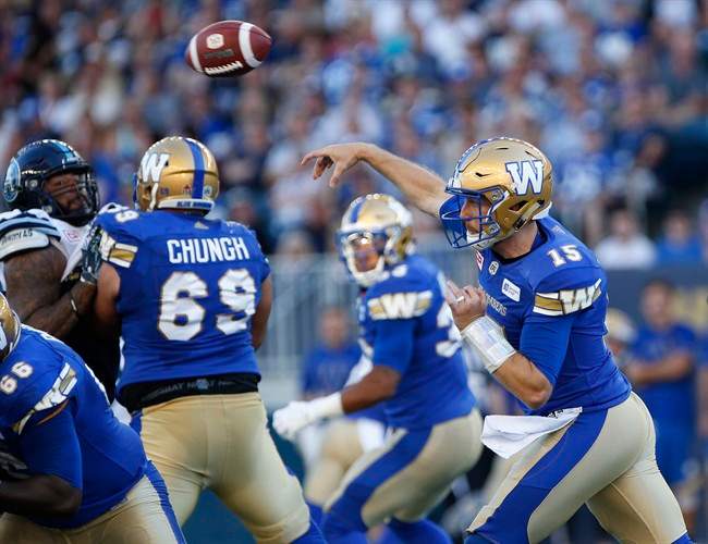 Winnipeg Blue Bombers' quarterback Matt Nichols (15) throws against the Toronto Argonauts during the first half of CFL action in Winnipeg Thursday, July 13, 2017. THE CANADIAN PRESS/John Woods.