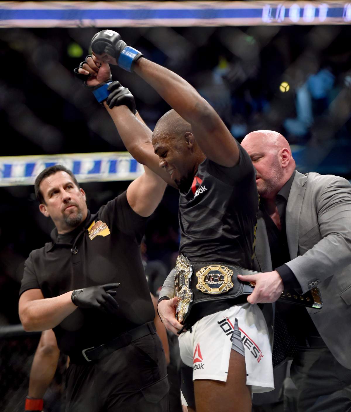 UFC President Dana White puts the UFC light heavyweight champion belt on Jon Jones after he defeated Daniel Cormier during UFC 214  in Anaheim, Calif., Saturday July 29, 2017. (Hans Gutknecht /Los Angeles Daily News via AP).