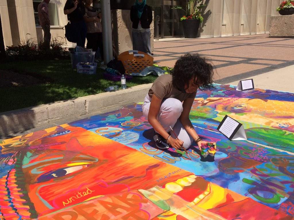 Shirug Faraj helps blend new elements added to the canvas, on July 19, 2017.