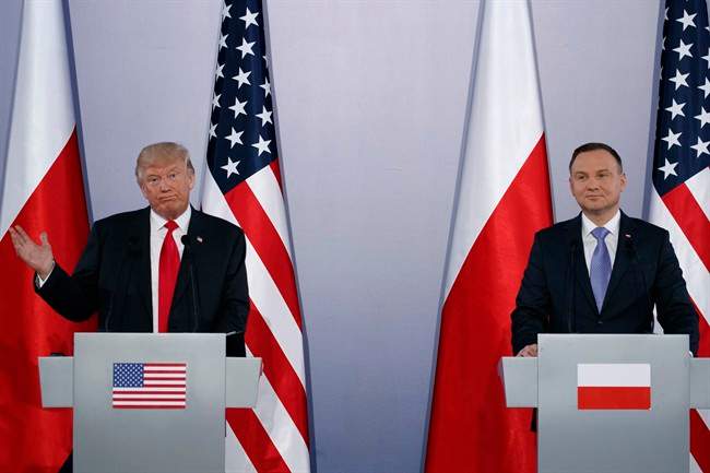 U.S. President Donald Trump, left, speaks during a news conference with Polish President Andrzej Duda at Royal Castle, Thursday.