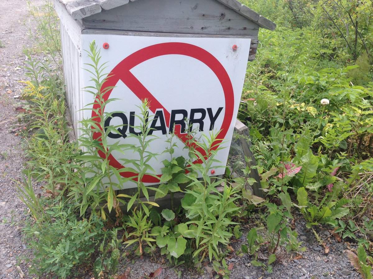 Residents in Estey's Bridge and Douglas, N.B. have signs on their properties opposing a new quarry in the area.