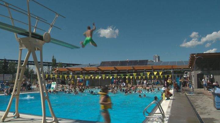People enjoy the sun and water at Queen Elizabeth Outdoor Pool Tuesday, July 4, 2017.