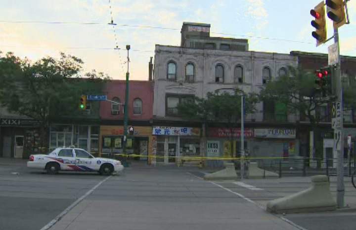 Police block off an area of Spadina Avenue in Toronto's Chinatown area following a partial roof collapse of a building under renovation on July 12, 2017.
