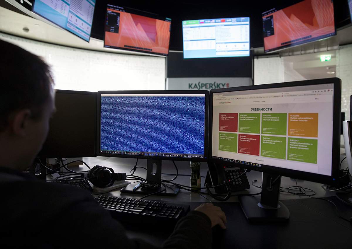 An employee of Kaspersky Lab works on computers at the company's headquarters in Moscow, Russia, Saturday, July 1, 2017. 