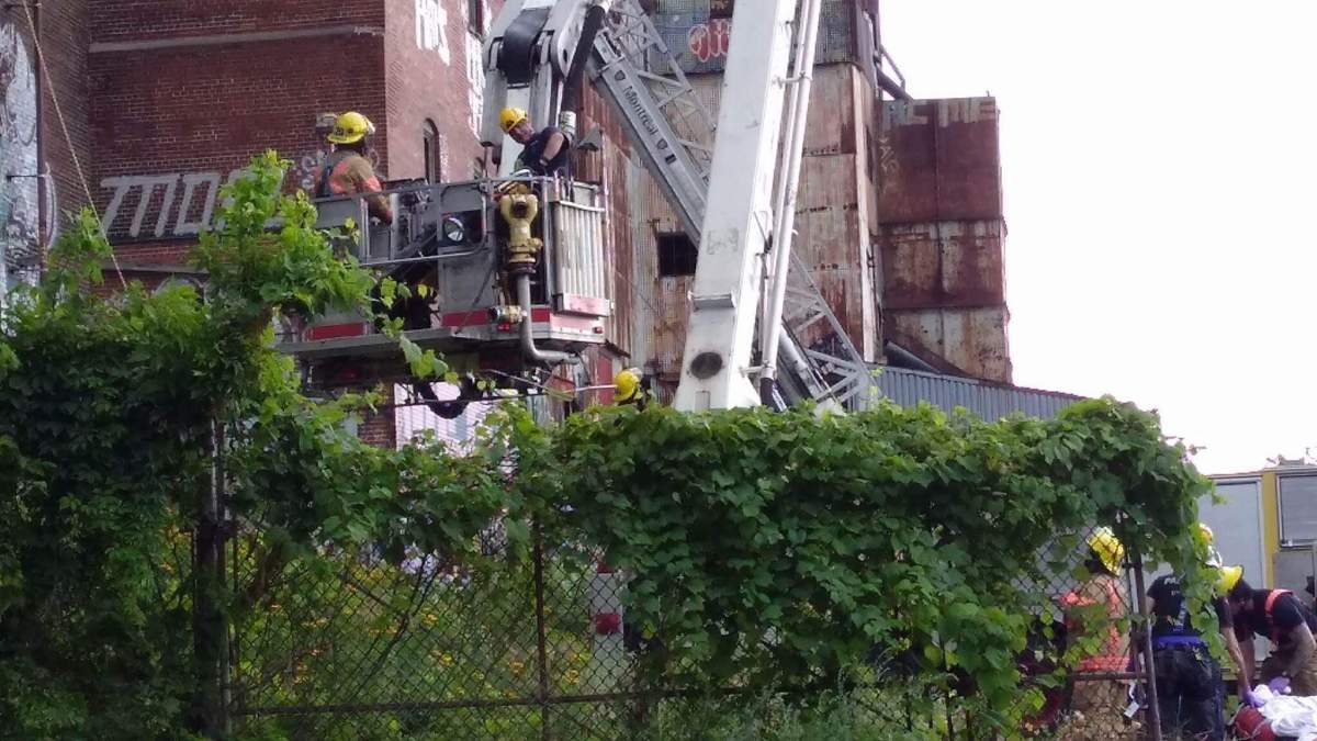 A 15-year-old boy is in hospital after falling from the eighth floor of Canada Malting Silos building in Saint-Henri, Monday, July 31, 2017.