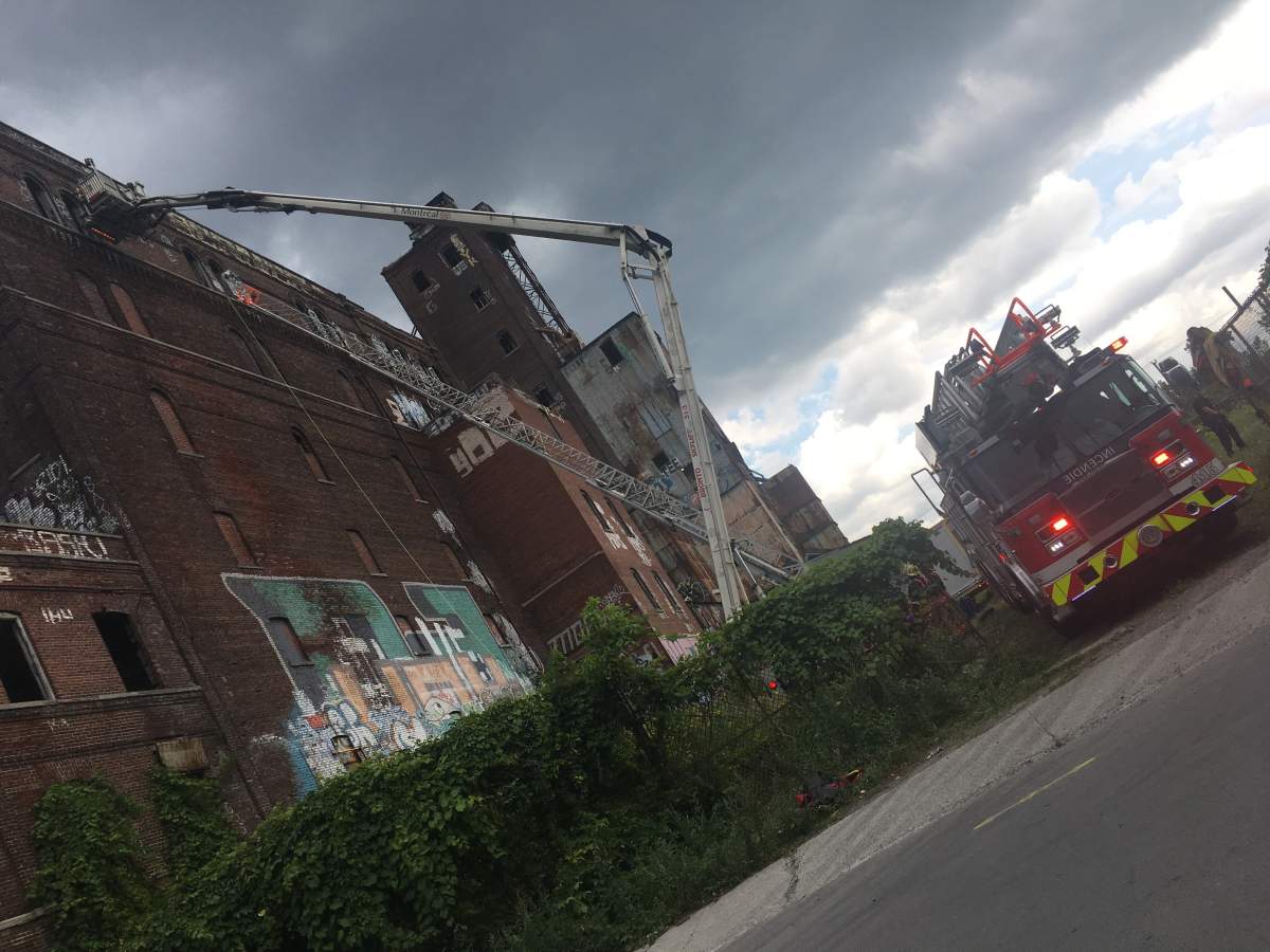 A 15-year-old boy is in hospital after falling from the eighth floor of Canada Malting Silos building in Saint-Henri, Monday, July 31, 2017.