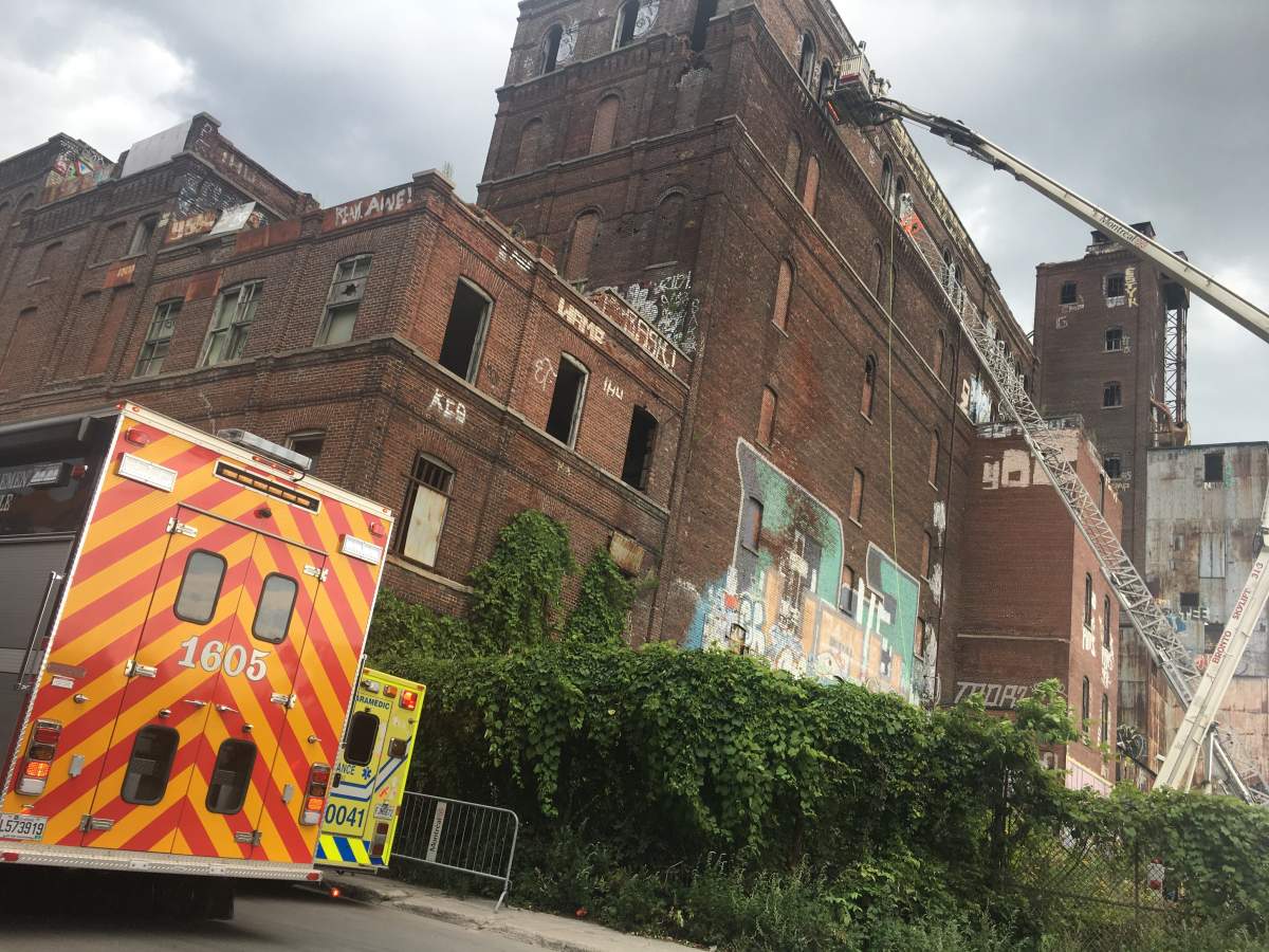 A 15-year-old boy is in hospital after falling from the eighth floor of Canada Malting Silos building in Saint-Henri, Monday, July 31, 2017.
