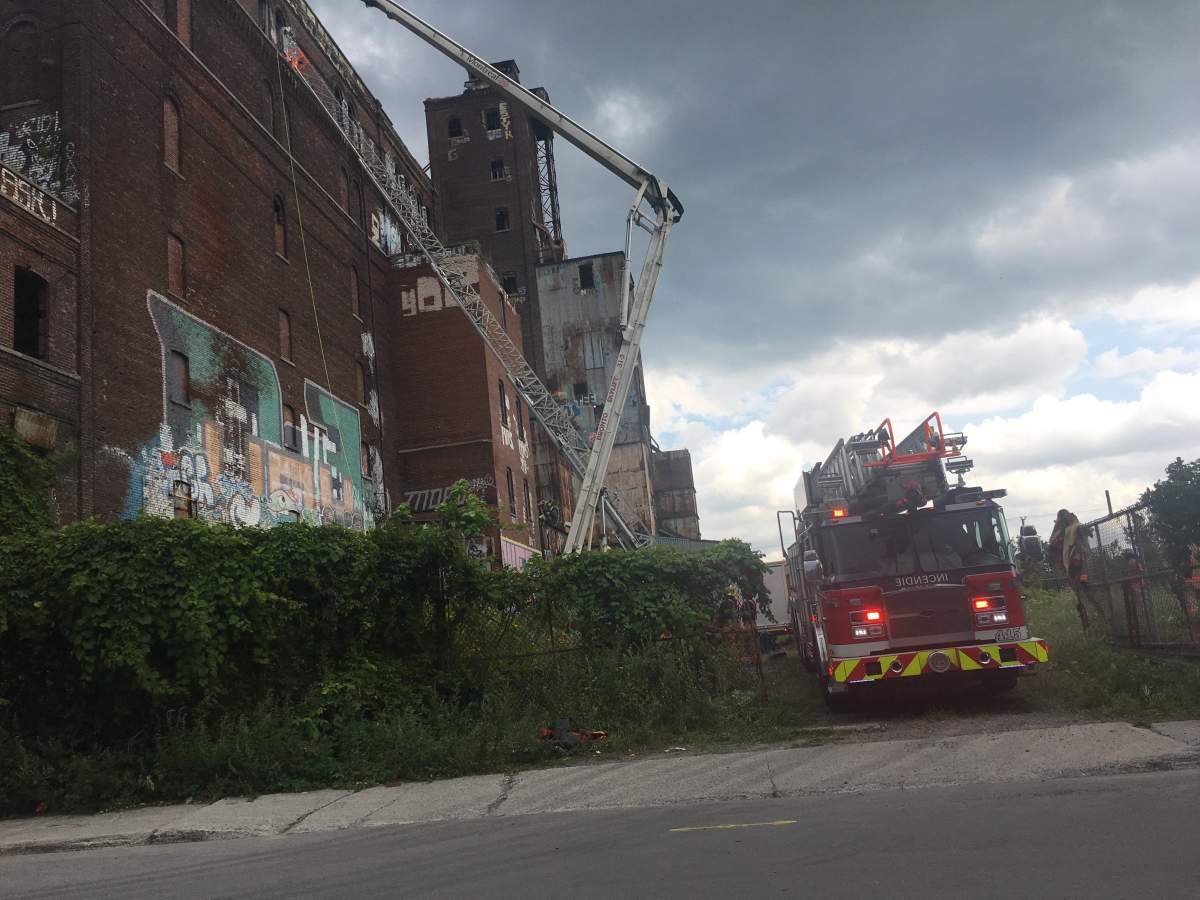 A 15-year-old boy is in hospital after falling from the eighth floor of Canada Malting Silos building in Saint-Henri, Monday, July 31, 2017.