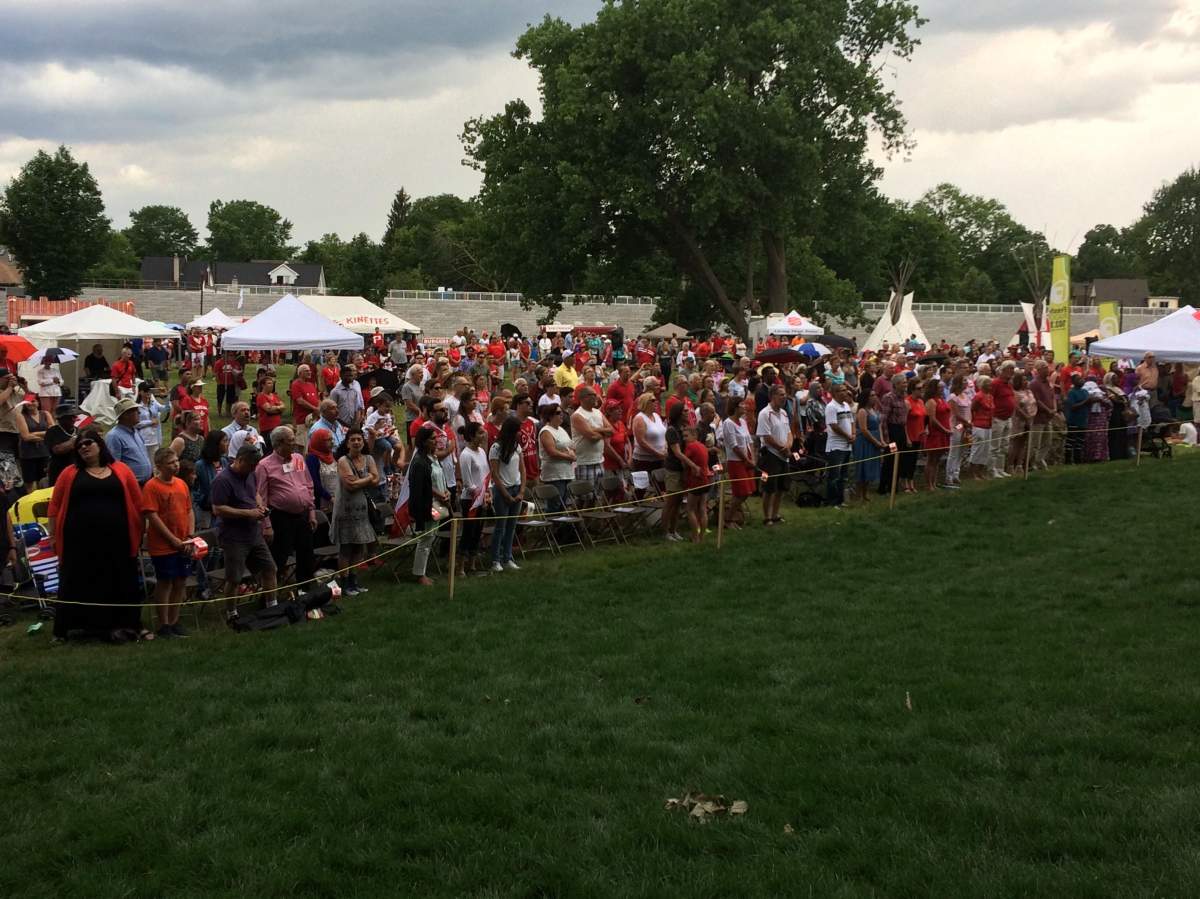 Hundreds gather at Harris Park to celebrate a citizenship ceremony on Canada Day.