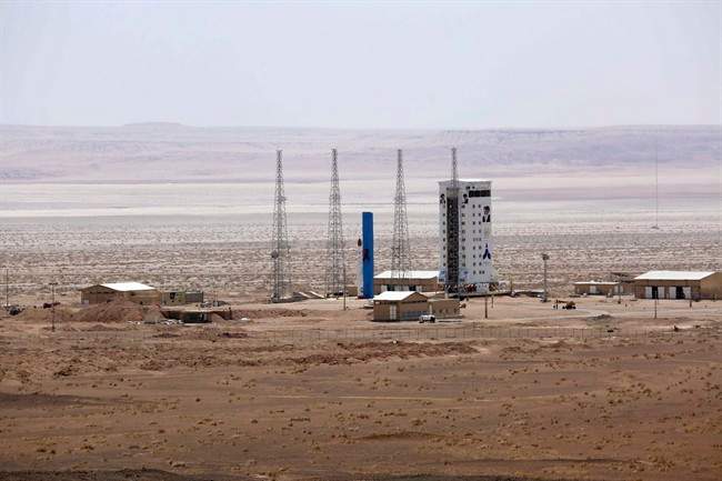 This picture released by the official website of the Iranian Defense Ministry on Thursday, July 27, 2017, claims to show the Simorgh satellite-carrying rocket, center, before being launched into space from Imam Khomeini National Space Center in an undisclosed location, Iran. 