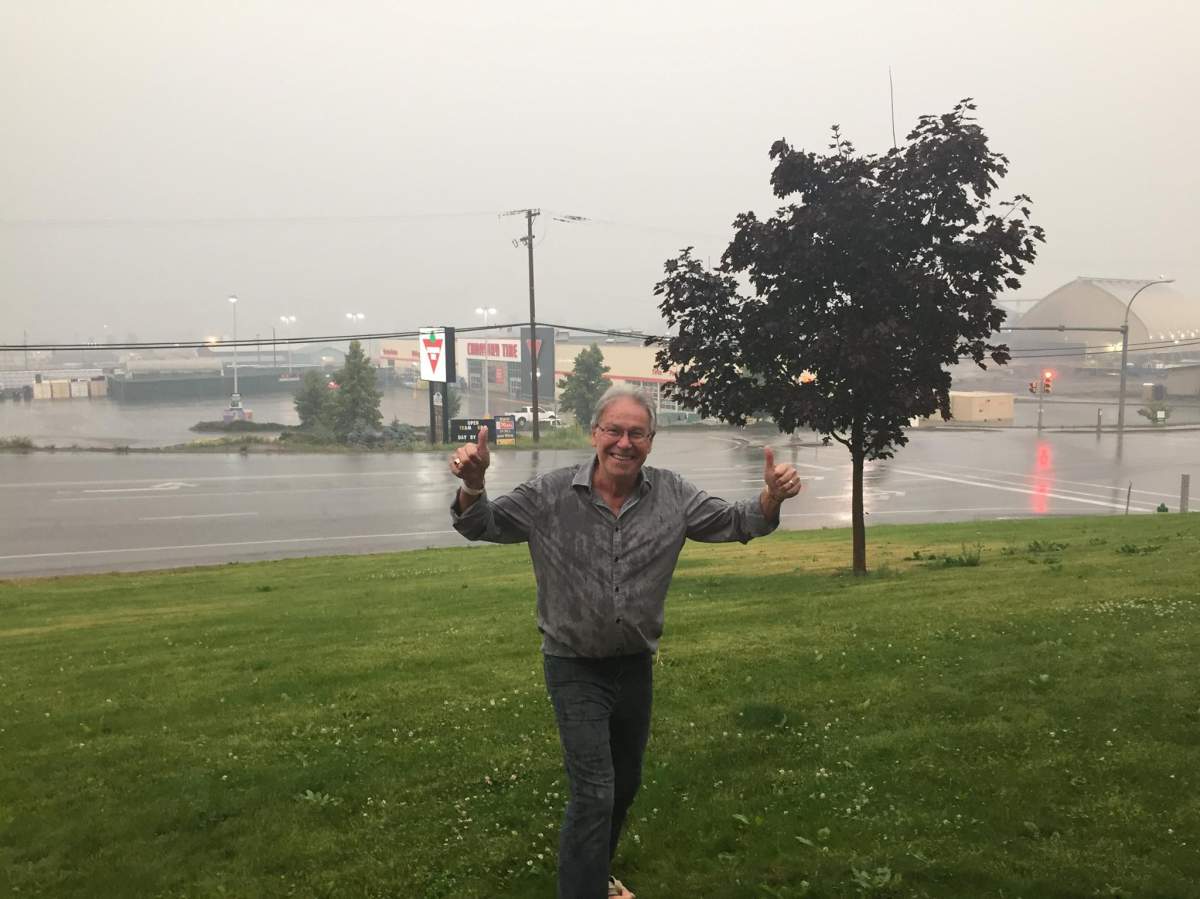 Williams Lake Mayor Walt Cobb gives the thumbs up during a much-needed dose of rain on Thursday.