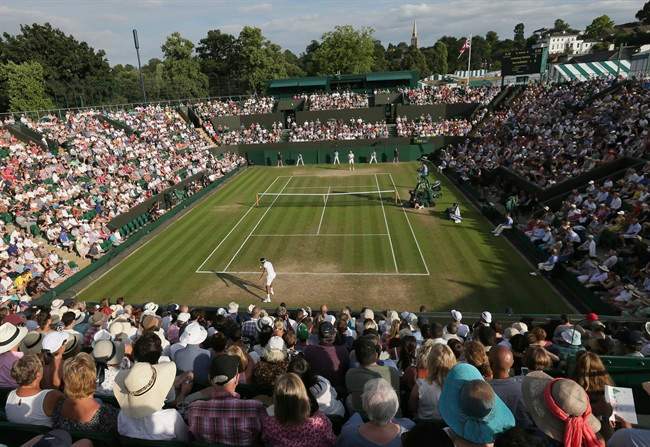 Jo‚ÄîWilfried Tsonga of France returns to Sam Querrey of the United States during their Men's Singles Match on day five at the Wimbledon Tennis Championships in London Friday, July 7, 2017.