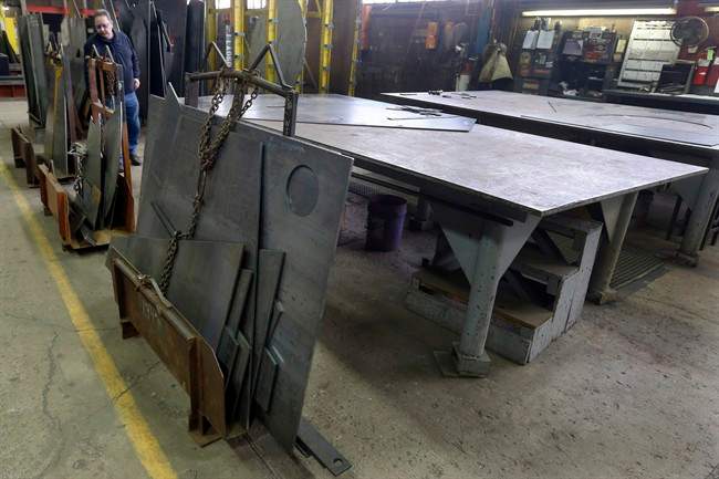 In this photo taken Feb. 12, 2015, cut panels of steel used to make blades to build fans for industrial ventilation systems are stored on the production floor in Harmony, Pa. President Donald Trump pledged during the campaign to help U.S. factory workers by slapping tariffs on foreign steel, but his long-awaited decision on the issue is running behind schedule. 