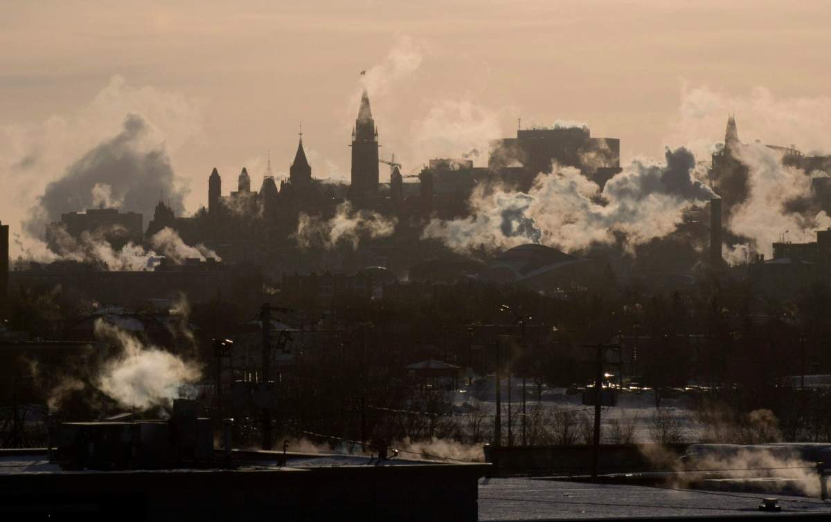 Winds blow vapour from buildings on the Ottawa skyline as temperatures hovered near -40C with windchill in Ottawa, Thursday, January 24, 2013.