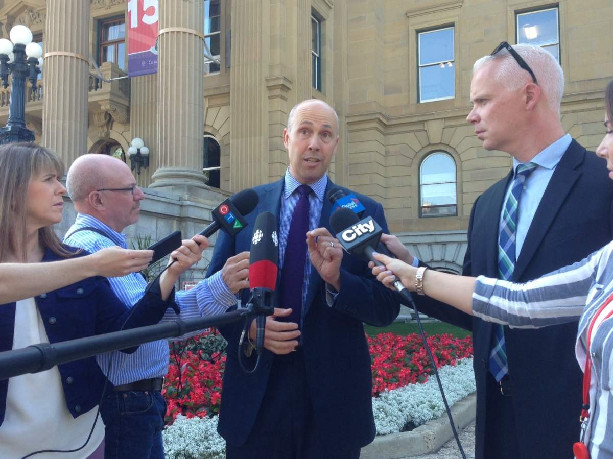 Former Alberta Party leader Greg Clark speaks to reporters outside the legislature on Thursday, Aug. 10, 2017.