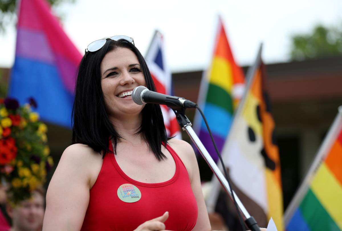 Michelle McHale, an organizer of the first Pride march in Steinbach, Man., speaks to a crowd on July 9, 2016.