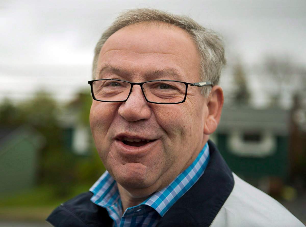 Premier Darrell Dexter talks with reporters after voting in the Nova Scotia provincial election in Cole Harbour, N.S. near Halifax on Tuesday, Oct. 8, 2013. Former premier Dexter has received an appointment to teach a public policy course at Dalhousie University. 