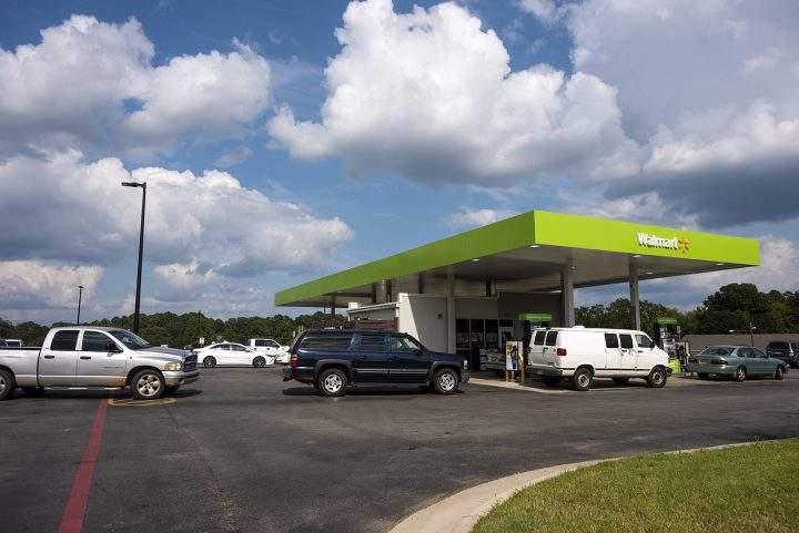People line up in their cars to fill their tanks with gas at a Walmart in Tyler, Texas, on Aug. 31, 2017.