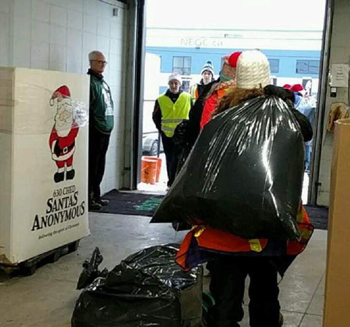 Volunteers deliver toys for 630 CHED Santas Anonymous Saturday, Dec. 17, 2016.