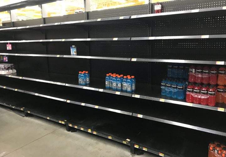 Shelves sit nearly empty in a Walmart store as residents stock ahead of Hurricane Harvey in Houston.