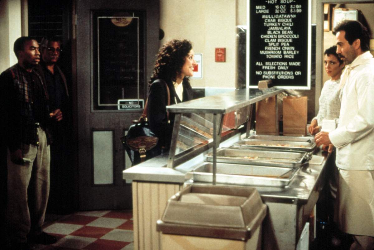 Julia Louis-Dreyfus and Larry Thomas as the Soup Nazi on an episode of Seinfeld.