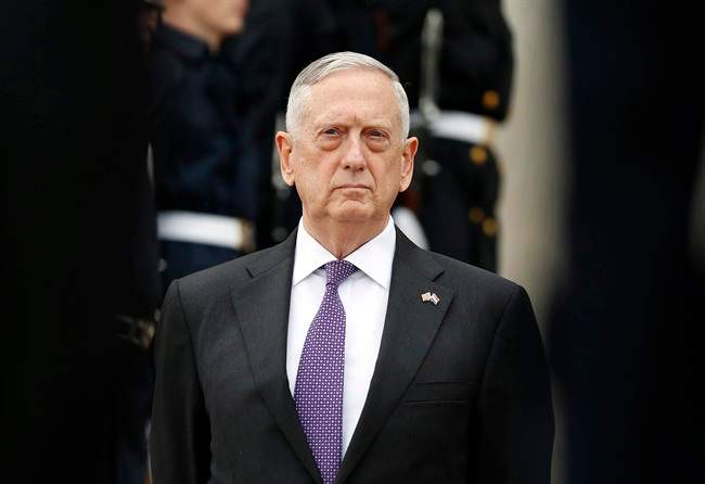 In this Tuesday, Aug. 15, 2017, file photo, U.S. Defense Secretary Jim Mattis stands as he waits for Netherlands Minister of Defense Jeanine Hennis-Plasschaert during an enhanced honor cordon at the Pentagon in Washington. U.S. 