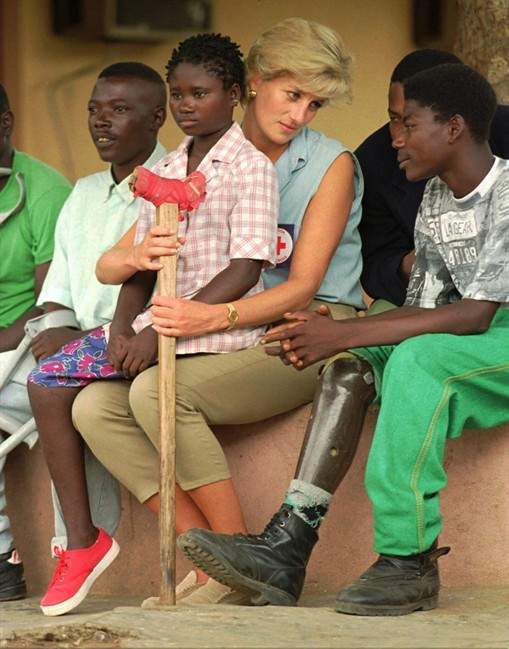 Diana, Princess of Wales, listens to former Angolan soldiers, victims of landmine explosions during 20 years of civil war, during a visit at Neves Bendinha orthopeadic hospital in Luanda.